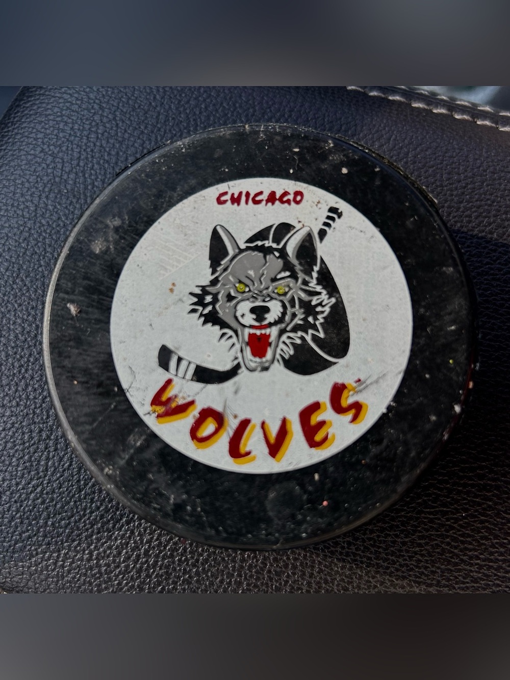 Chicago Wolves Vintage GAME Hockey Puck - Black, White, Red, Yellow.